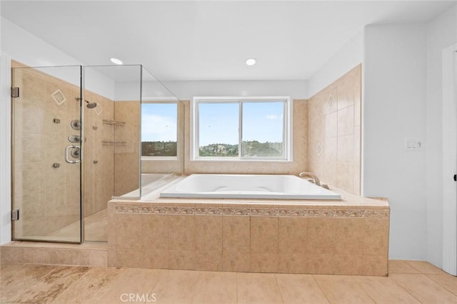 bathroom with a garden tub, a stall shower, tile patterned flooring, and recessed lighting