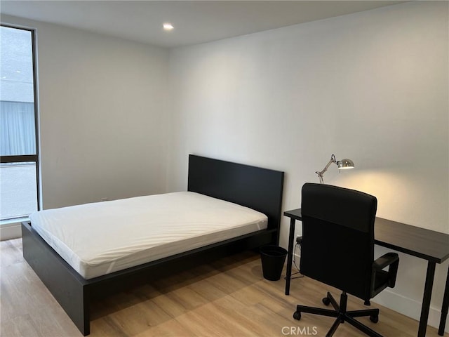 1250 S Beverly Glen Blvd Unit 205, Los Angeles, CA 90024 - bedroom with wood finished floors, multiple windows, and recessed lighting