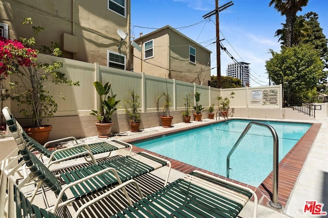 1250 S Beverly Glen Blvd Unit 205, Los Angeles, CA 90024 - community pool featuring a fenced backyard and a patio