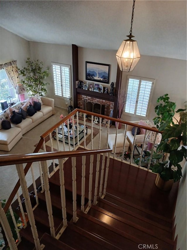 11537 Moonridge Dr, Whittier, CA 90601 - stairway with carpet and a fireplace