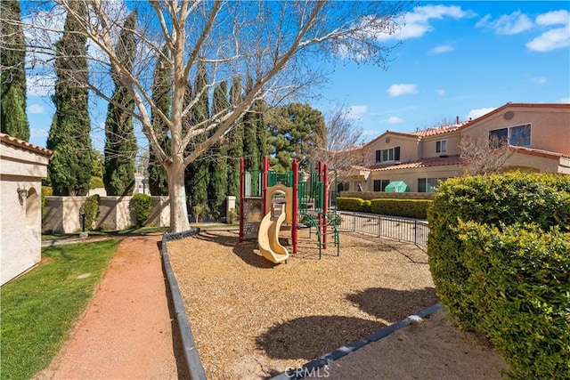 communal playground featuring fence