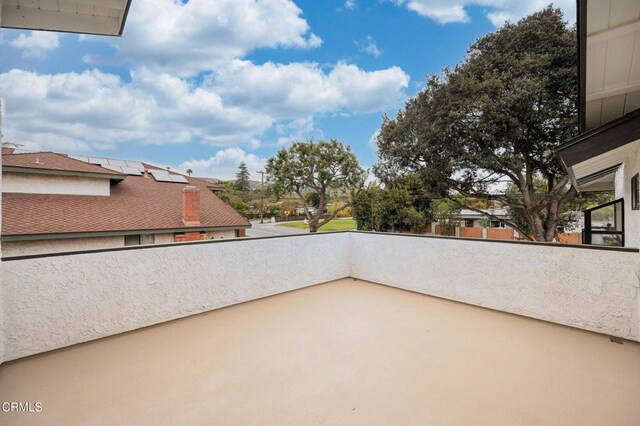 view of patio featuring a balcony