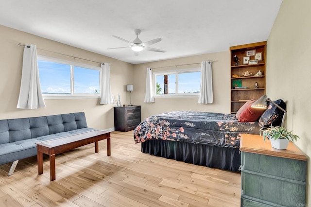 bedroom with ceiling fan and wood finished floors