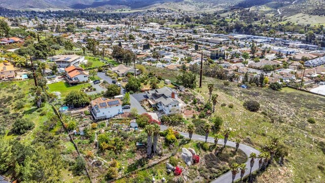 aerial view featuring a residential view and a mountain view