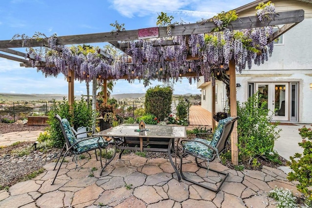 view of patio featuring outdoor dining space and french doors
