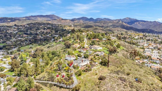birds eye view of property with a residential view and a mountain view