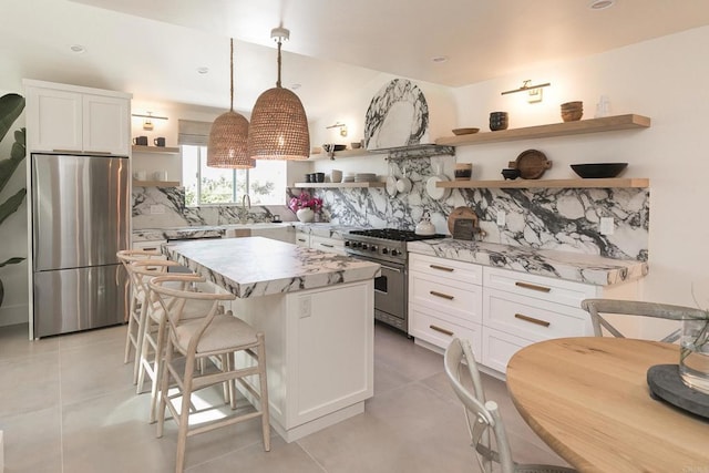 164 Chestnut Ave, Carlsbad, CA 92008 - kitchen featuring open shelves, stainless steel appliances, white cabinets, decorative backsplash, and recessed lighting