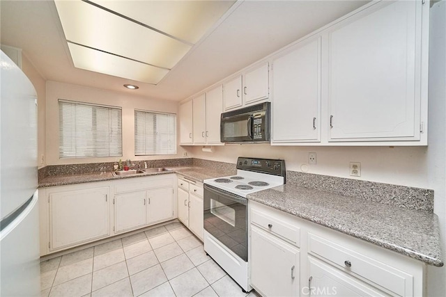 kitchen with white cabinetry, recessed lighting, white appliances, light tile patterned floors, and a sink