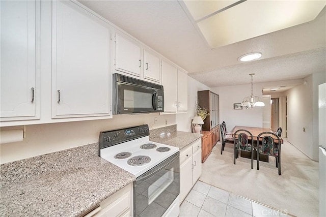 kitchen featuring white range with electric cooktop, white cabinets, an inviting chandelier, and black microwave
