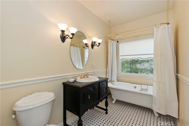 27601 Cedarwood Dr, Lake Arrowhead, CA 92352 - full bathroom with toilet, vanity, and a freestanding tub