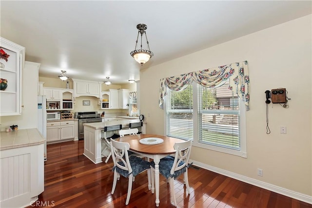 27601 Cedarwood Dr, Lake Arrowhead, CA 92352 - dining room featuring dark wood finished floors and baseboards