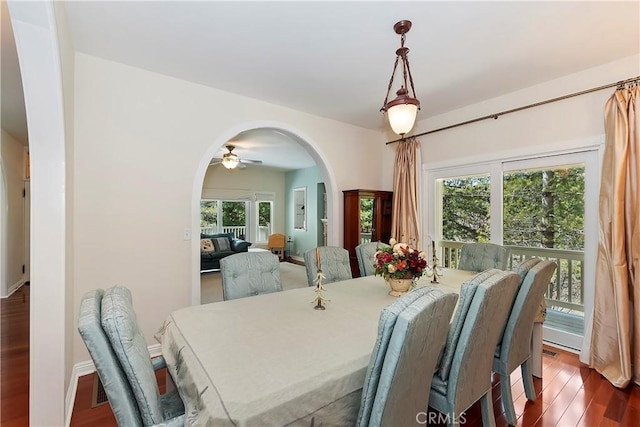 27601 Cedarwood Dr, Lake Arrowhead, CA 92352 - dining area with ceiling fan, arched walkways, and wood finished floors