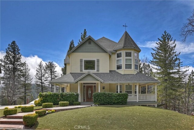 27601 Cedarwood Dr, Lake Arrowhead, CA 92352 - victorian home featuring a porch and a front yard