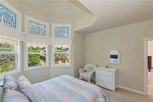 27601 Cedarwood Dr, Lake Arrowhead, CA 92352 - bedroom with light carpet, baseboards, and multiple windows