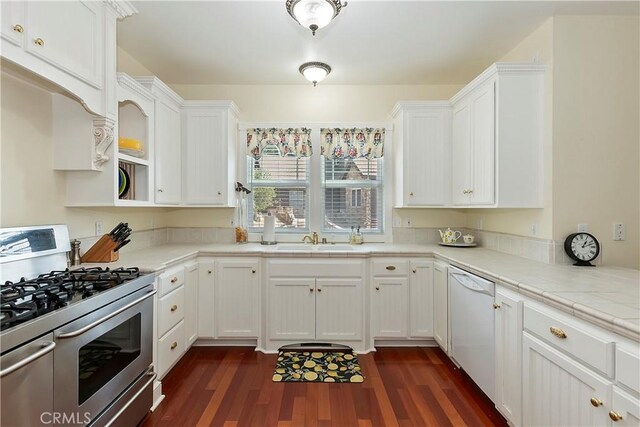27601 Cedarwood Dr, Lake Arrowhead, CA 92352 - kitchen featuring a sink, stainless steel gas stove, white cabinetry, dark wood-type flooring, and dishwasher