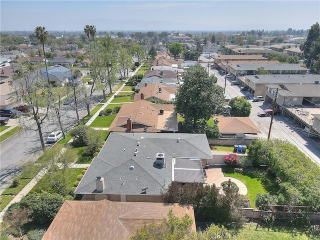 birds eye view of property with a residential view