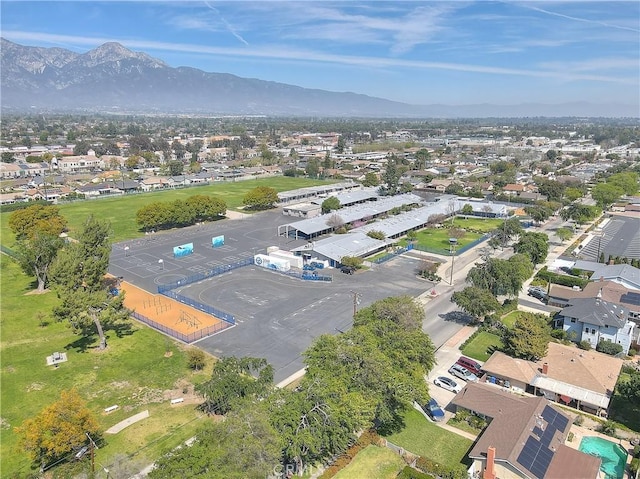 drone / aerial view featuring a residential view and a mountain view
