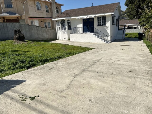 3391 Scarboro St, Los Angeles, CA 90065 - back of property with stucco siding, concrete driveway, and roof with shingles