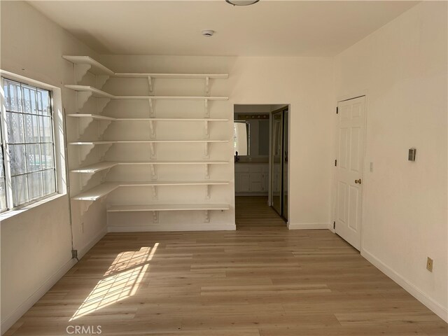 3391 Scarboro St, Los Angeles, CA 90065 - spare room with light wood-type flooring, a smoke detector, and baseboards
