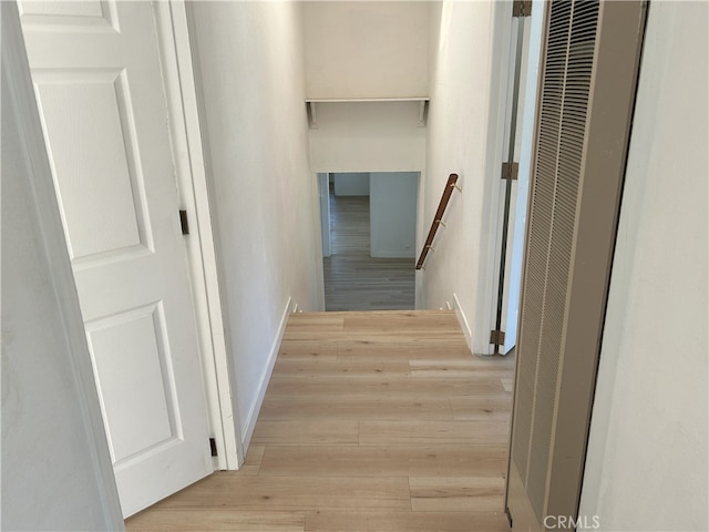 3391 Scarboro St, Los Angeles, CA 90065 - hallway with a heating unit, an upstairs landing, and light wood-style floors