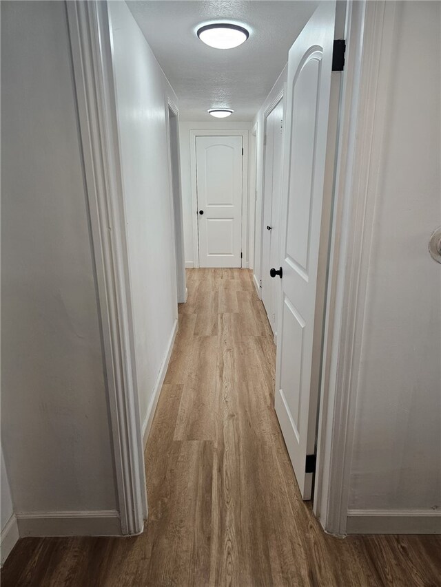 1043 W Orange Rd, Santa Ana, CA 92706 - hallway featuring wood finished floors and baseboards