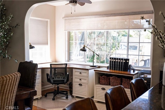 office space featuring ceiling fan and light wood-type flooring