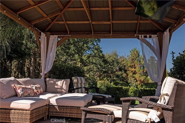 view of patio featuring outdoor lounge area and a gazebo
