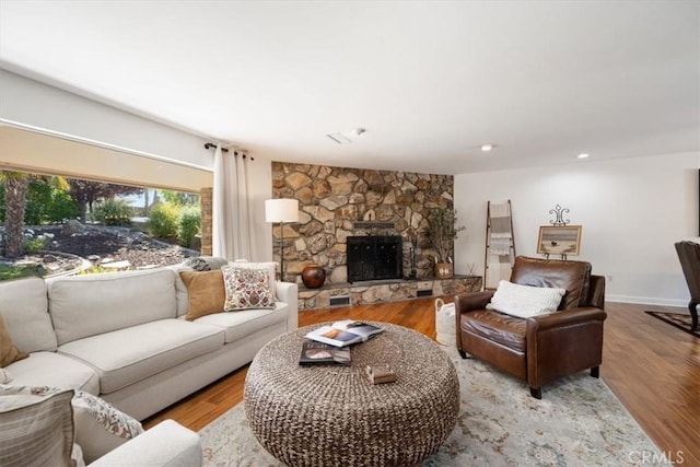 1040 Par Ave, Paso Robles, CA 93446 - living room with a fireplace, wood finished floors, baseboards, and recessed lighting