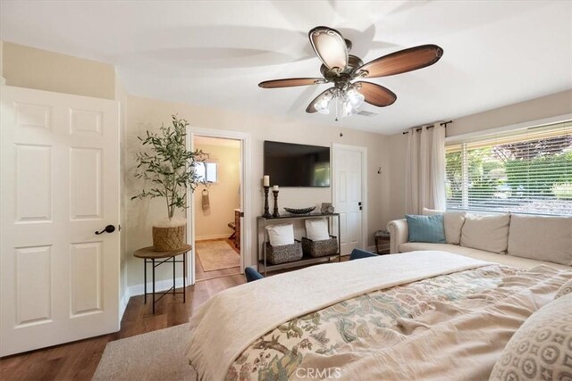 1040 Par Ave, Paso Robles, CA 93446 - bedroom featuring wood finished floors, ceiling fan, ensuite bath, and baseboards