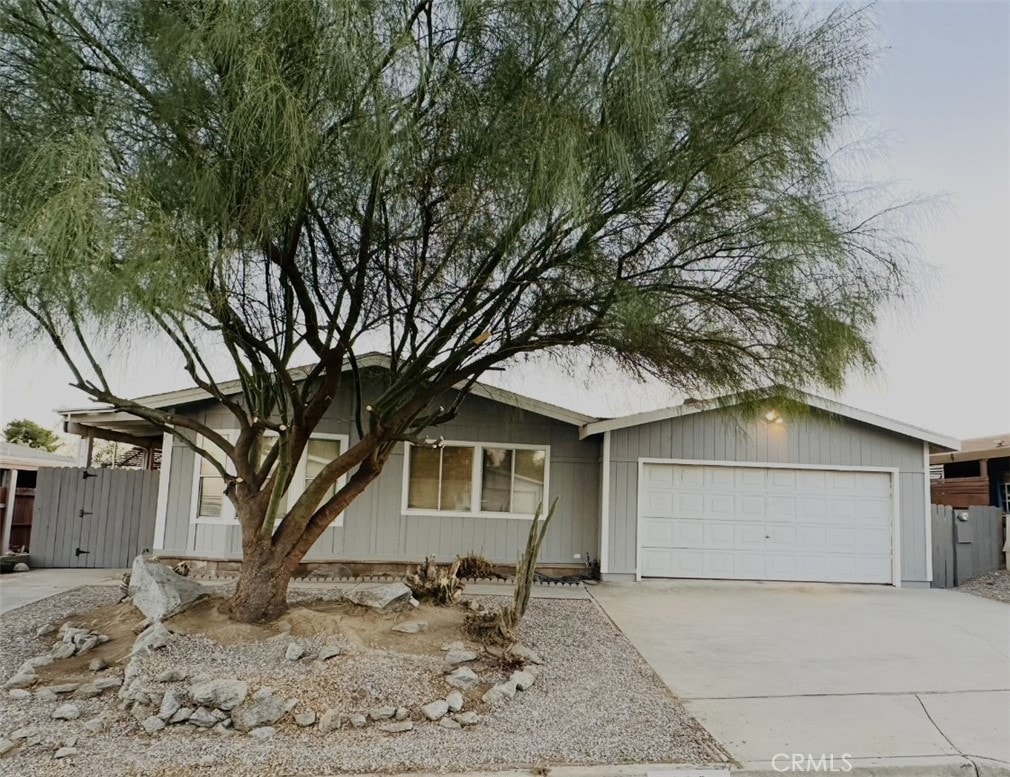 view of front of home with driveway and an attached garage