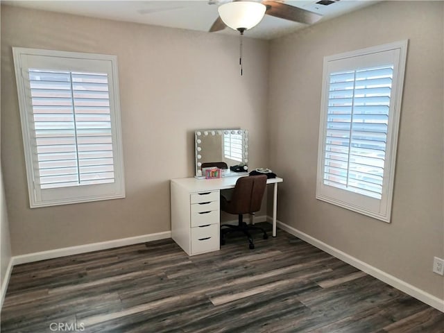 home office featuring dark wood finished floors, baseboards, and a ceiling fan