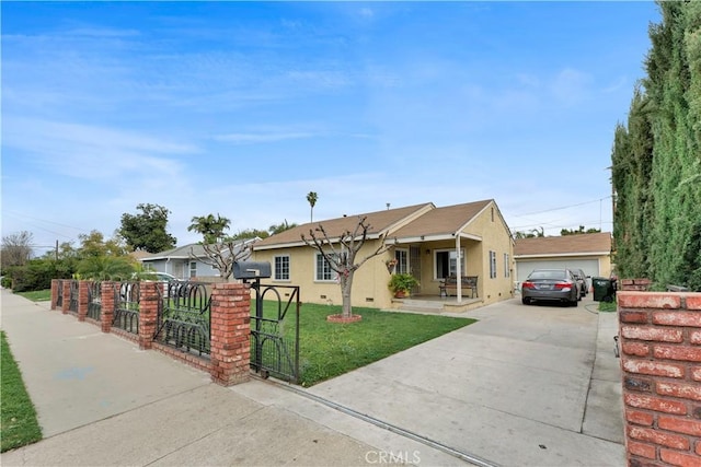 view of front of home featuring stucco siding and a gate
