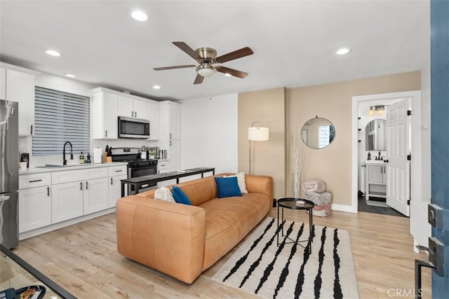 1727 W 59th Pl, Los Angeles, CA 90047 - living room featuring ceiling fan, light wood finished floors, and recessed lighting