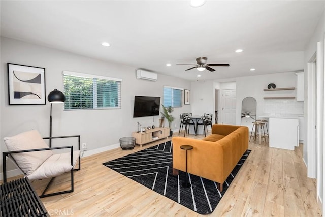 1727 W 59th Pl, Los Angeles, CA 90047 - living room featuring ceiling fan, an AC wall unit, light wood-style floors, and recessed lighting