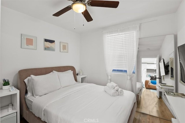 1727 W 59th Pl, Los Angeles, CA 90047 - bedroom with light wood finished floors and a ceiling fan