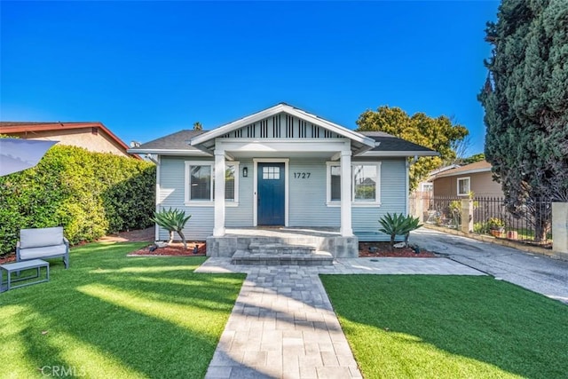 1727 W 59th Pl, Los Angeles, CA 90047 - bungalow-style house with covered porch and board and batten siding