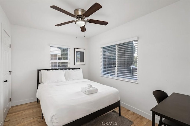 1727 W 59th Pl, Los Angeles, CA 90047 - bedroom with light wood-style floors and ceiling fan