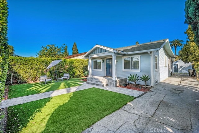 1727 W 59th Pl, Los Angeles, CA 90047 - bungalow-style house featuring asphalt driveway, a front yard, and a porch