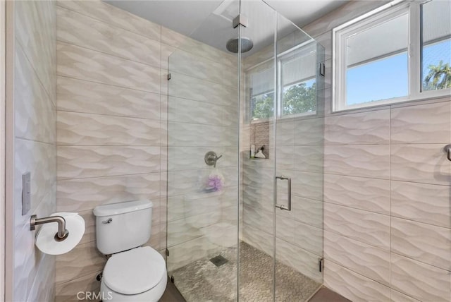 14084 Bronte Dr, Whittier, CA 90602 - bathroom featuring toilet, tile walls, and a shower stall