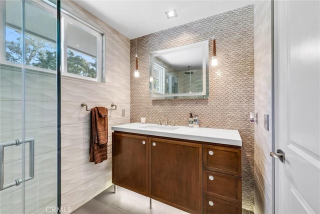 14084 Bronte Dr, Whittier, CA 90602 - bathroom featuring tile patterned floors, vanity, a stall shower, and tile walls