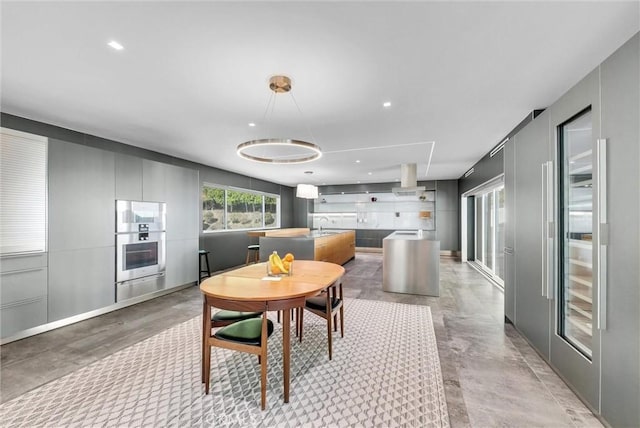 14084 Bronte Dr, Whittier, CA 90602 - dining area featuring recessed lighting and finished concrete floors
