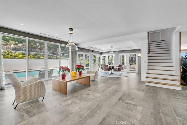 14084 Bronte Dr, Whittier, CA 90602 - living room featuring stairs, a tray ceiling, and french doors
