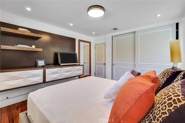 14084 Bronte Dr, Whittier, CA 90602 - bedroom with a closet, visible vents, and wood finished floors