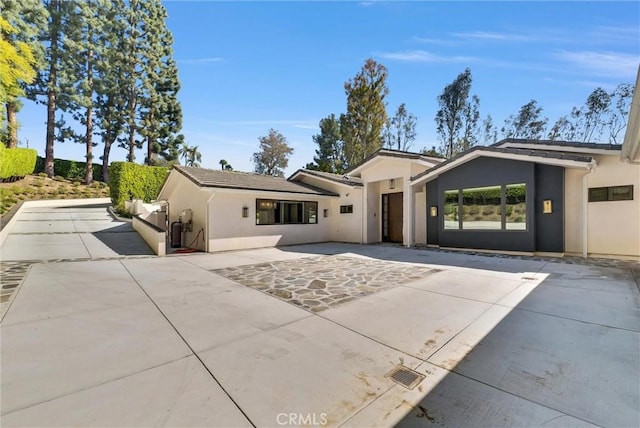 14084 Bronte Dr, Whittier, CA 90602 - view of front facade featuring stucco siding and a patio
