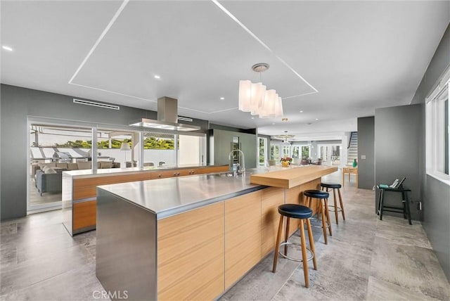 14084 Bronte Dr, Whittier, CA 90602 - kitchen featuring a large island, modern cabinets, a sink, and open floor plan