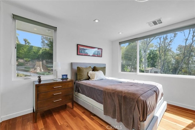 14084 Bronte Dr, Whittier, CA 90602 - bedroom featuring baseboards, visible vents, and wood finished floors