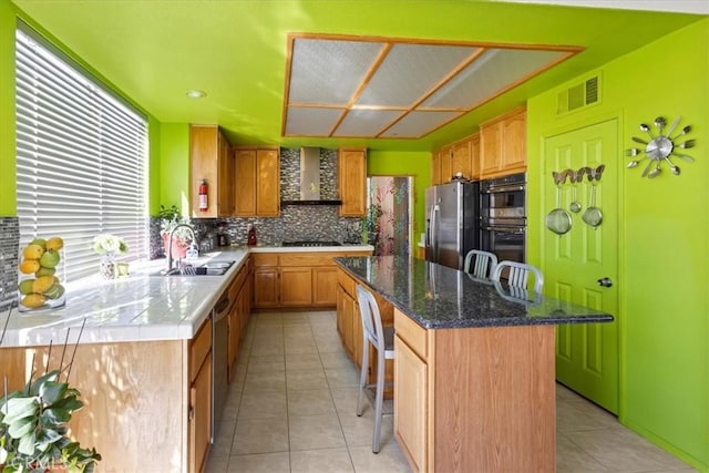 19189 San Jacinto Way, Apple Valley, CA 92308 - kitchen with a sink, appliances with stainless steel finishes, wall chimney range hood, a kitchen island, and light tile patterned floors