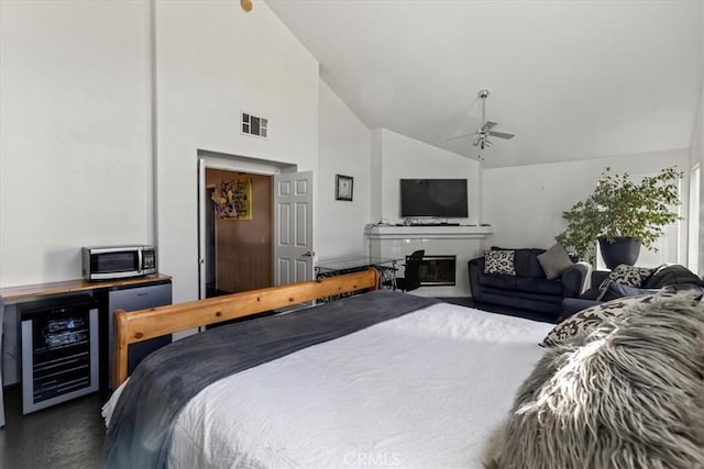 19189 San Jacinto Way, Apple Valley, CA 92308 - bedroom with a glass covered fireplace, wine cooler, visible vents, ceiling fan, and high vaulted ceiling