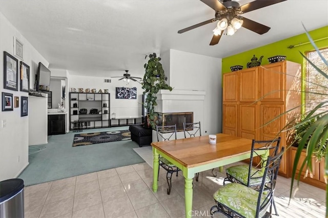 19189 San Jacinto Way, Apple Valley, CA 92308 - dining area with light colored carpet, ceiling fan, and light tile patterned floors