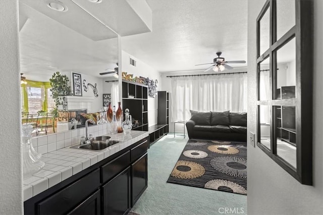 19189 San Jacinto Way, Apple Valley, CA 92308 - kitchen with tile countertops, ceiling fan, open floor plan, and a sink